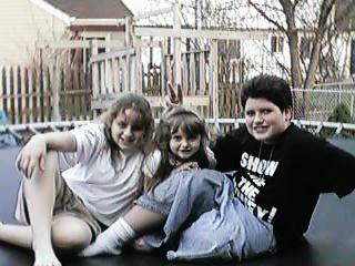 Picture of Alex with Daegan and Kay on the trampoline taken on March 29th